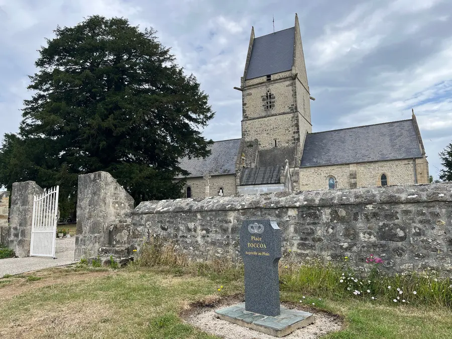 The small twelfth-century stone church at Angoville-au-Plain, seen from the roadside.