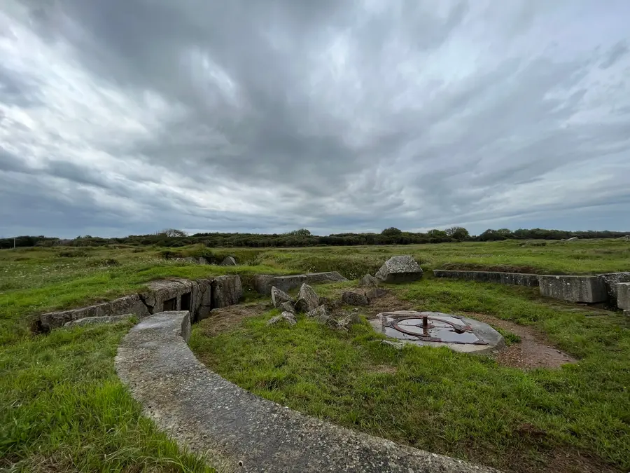 The shattered concrete remains of a German gun casemate at Pointe du Hoc.