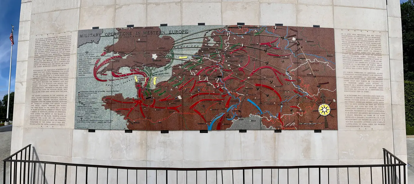 A large engraved stone map showing Allied military operations across Western Europe in 1944 and 1945.